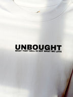 Neon side seam detail on UNBOUGHT football tee
