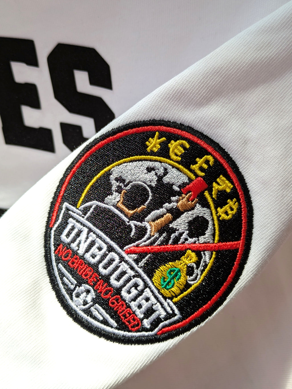 Embroidered patch on a white background with text and graphics.