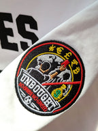 Embroidered patch on a white background with text and graphics.